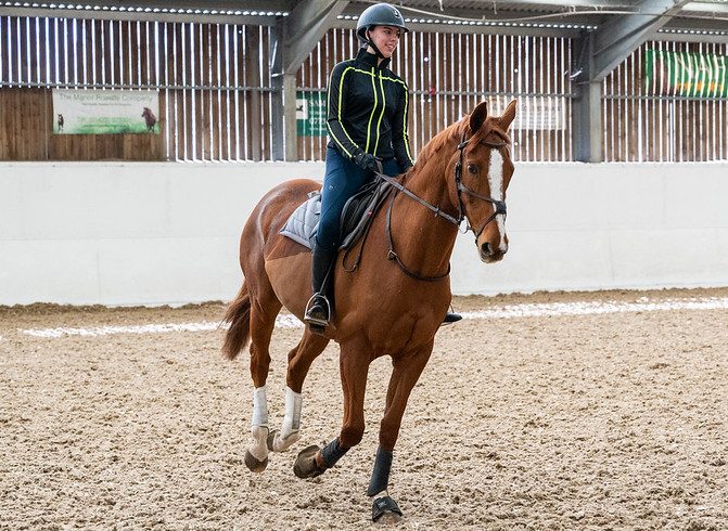student riding a horse