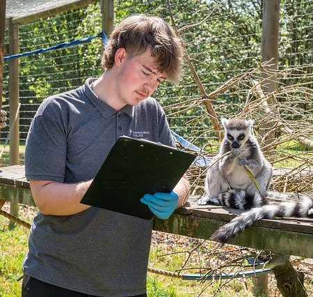 student with lemurs