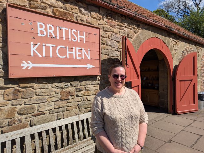 Figure stood outside British Kitchen.