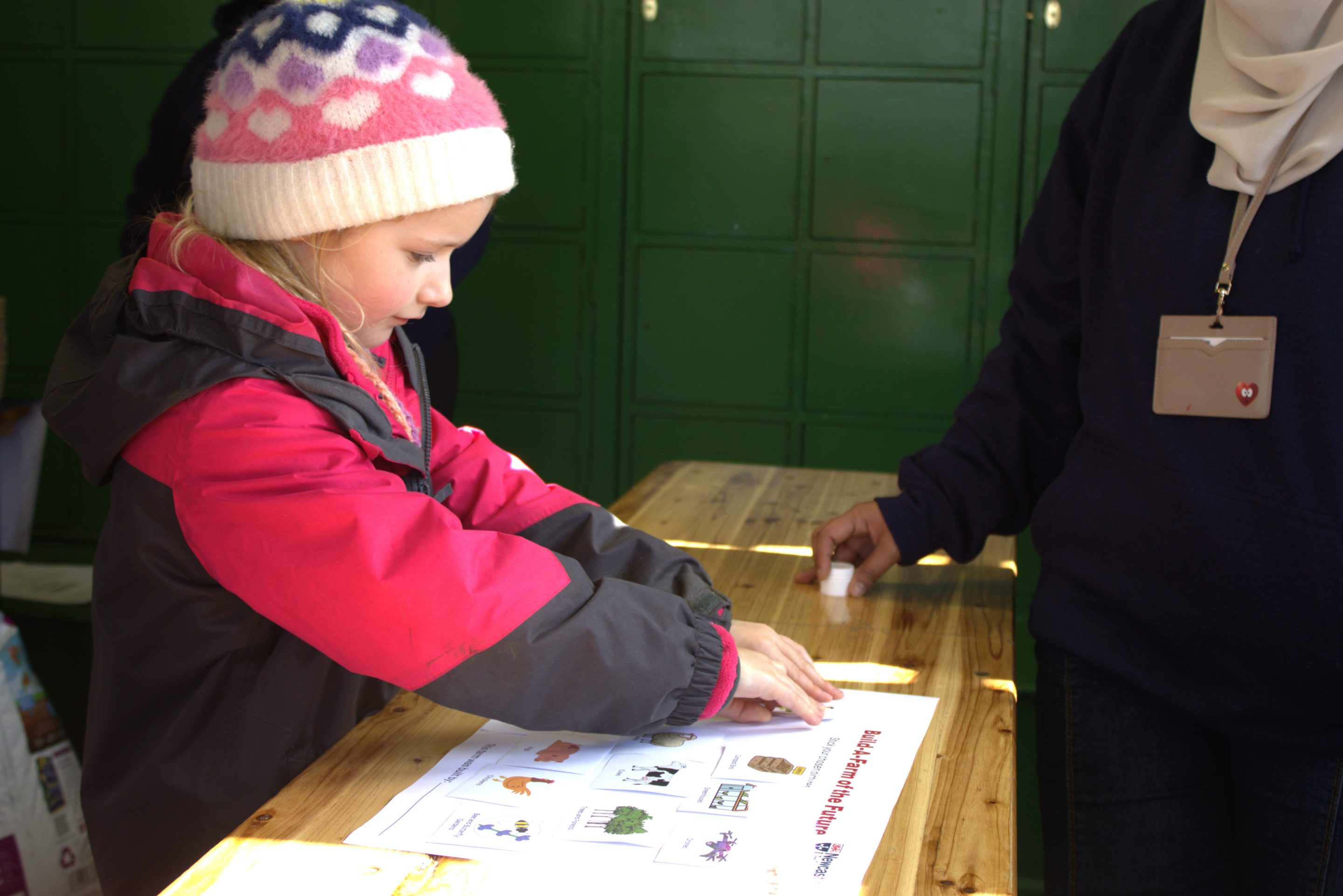 Young person sticking pictures.