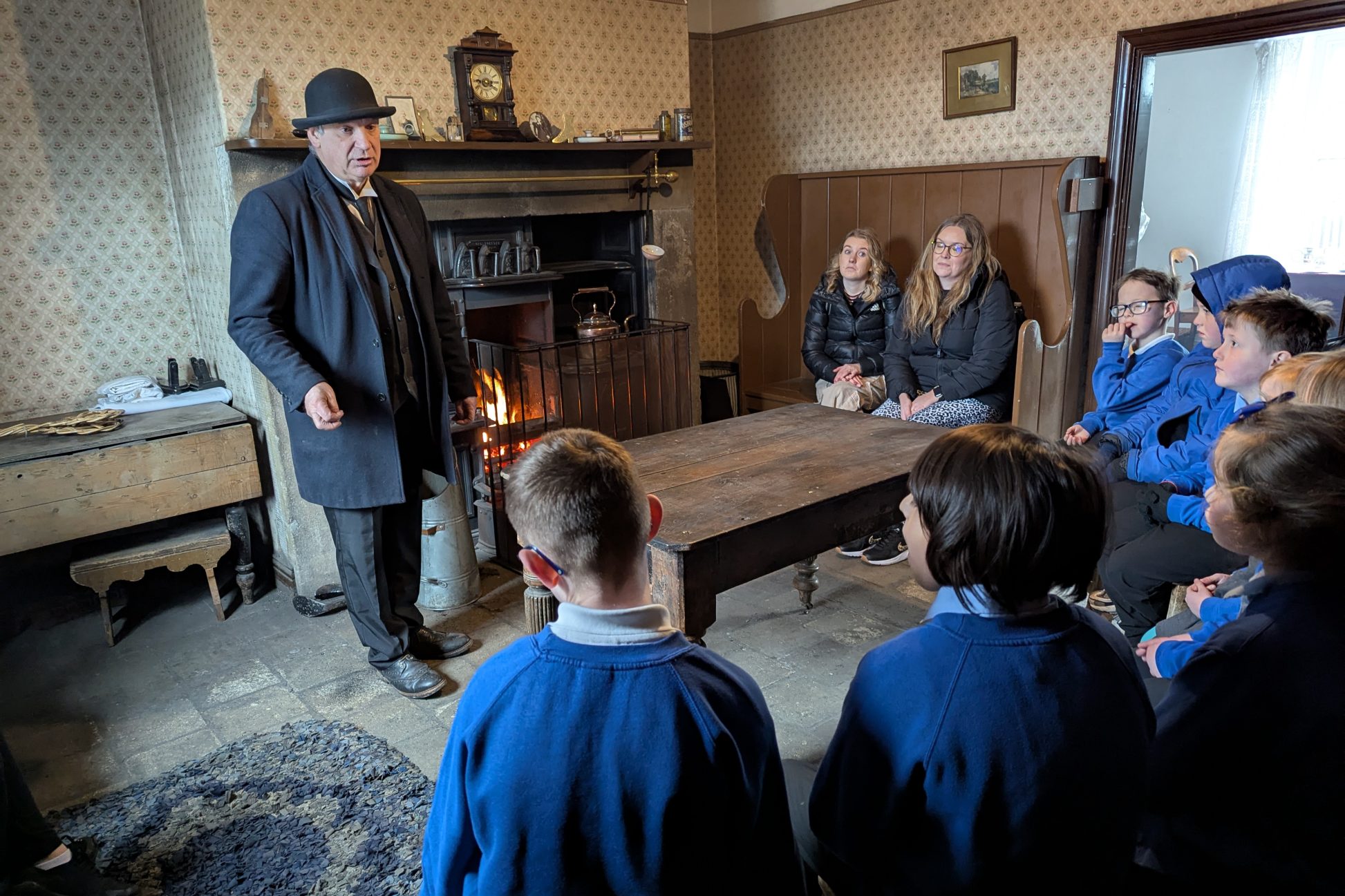School children with costumed staff member in 1900s Pit Village.