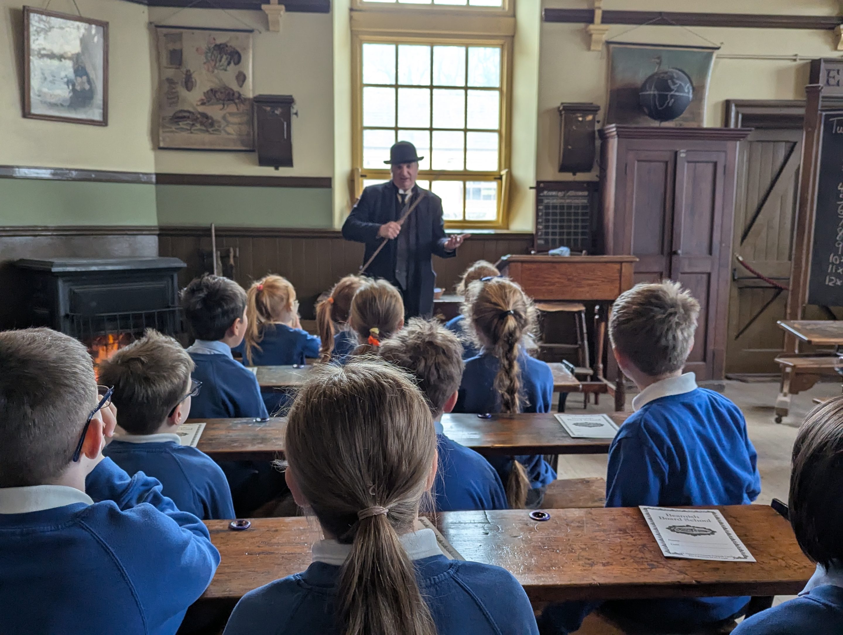 School children with costumed staff member in 1900s Pit Village.