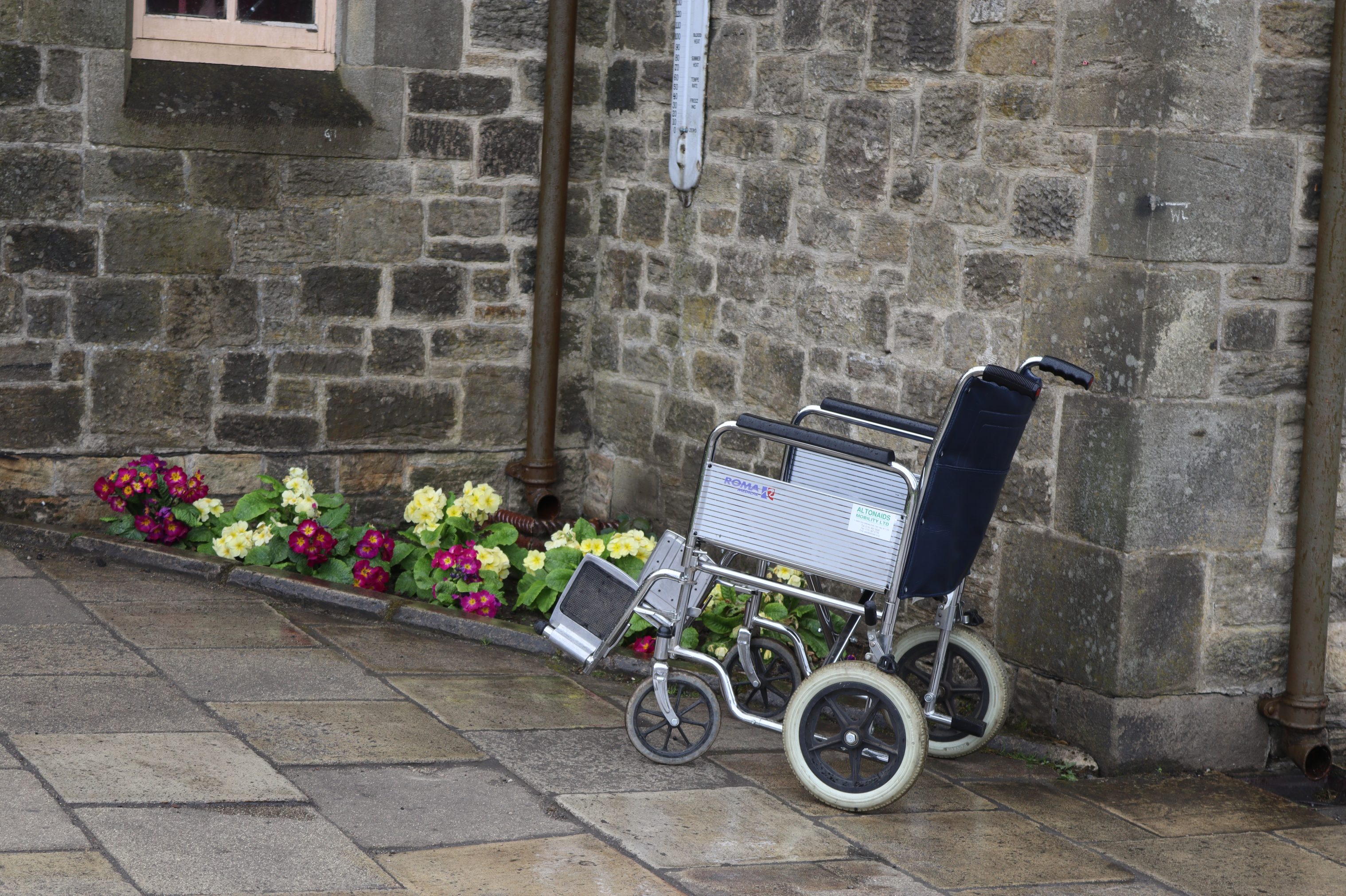 Wheelchair on path, in 1900s Pit Village.