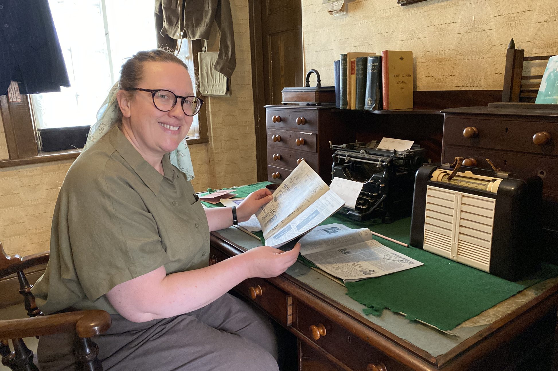 Costumed staff member smiling.