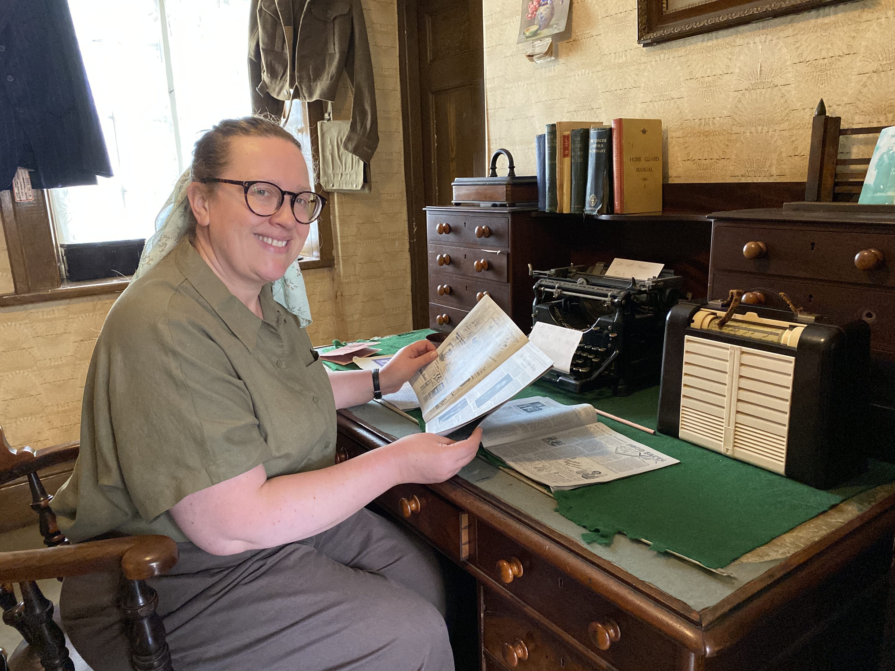 Costumed staff member smiling.