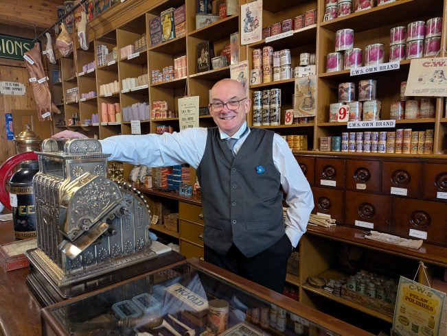 Costumed staff member in coop.