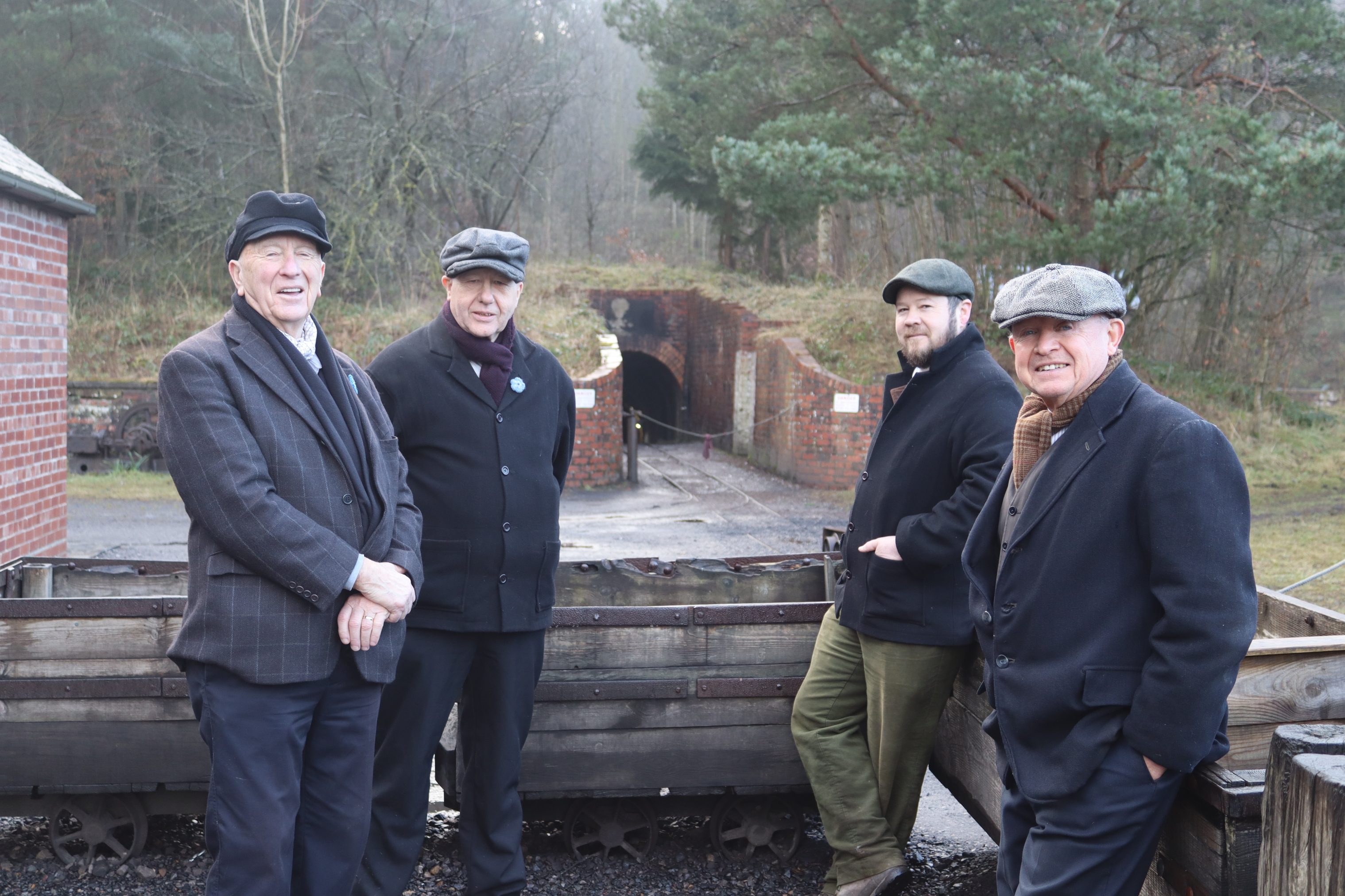Group of staff members outside drift mine.