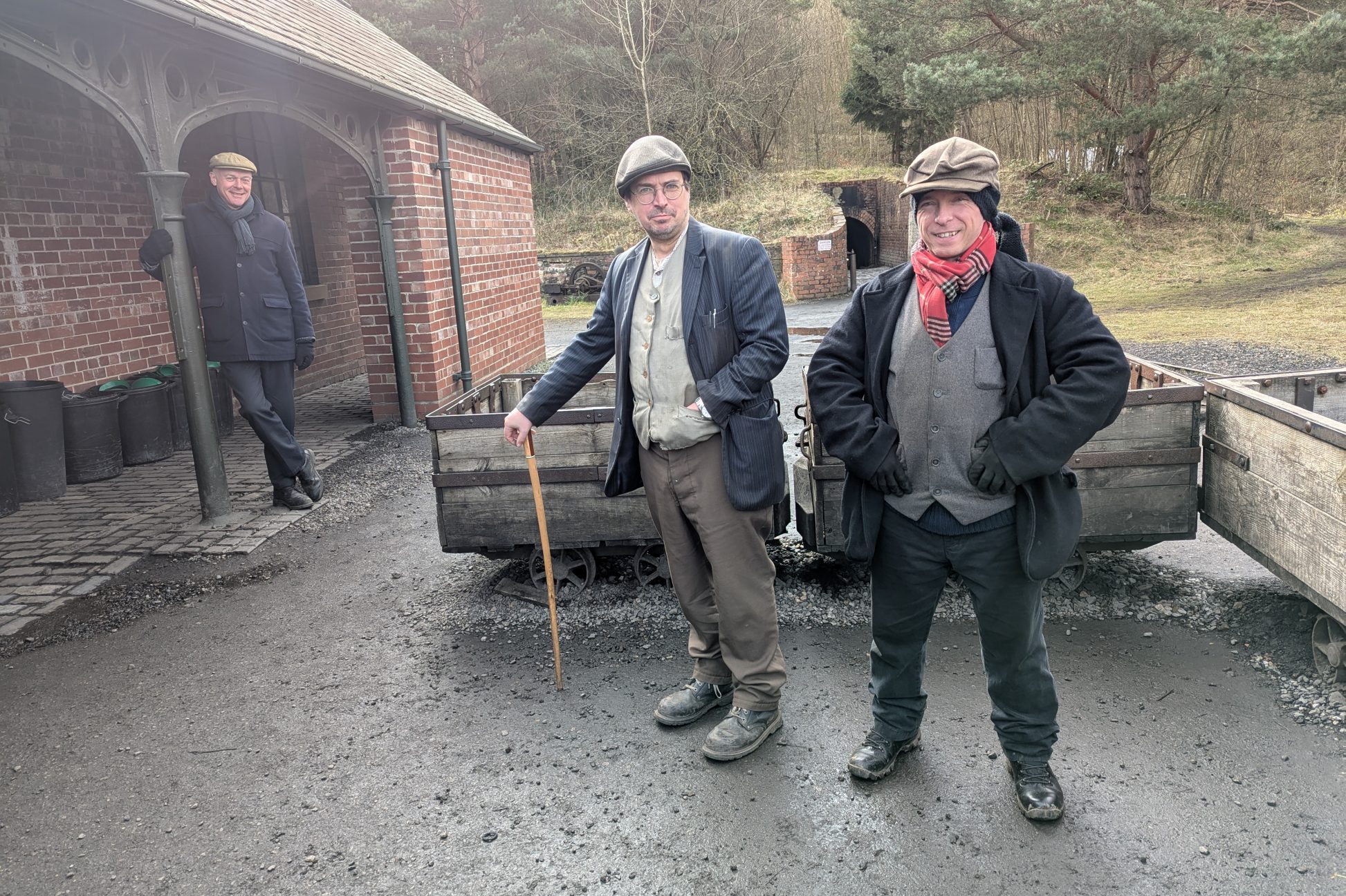 Three staff members outside drift mine.