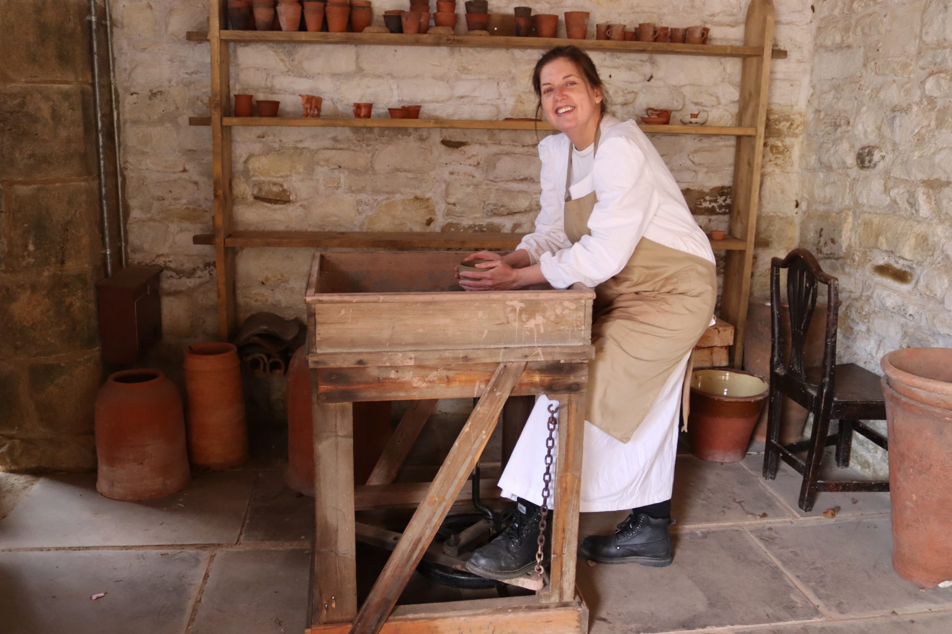 Figure at 1820s potter's wheel.