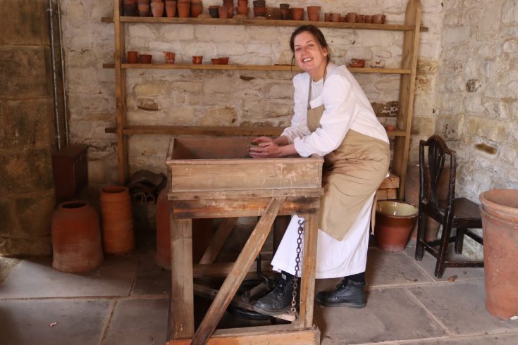 Figure at 1820s potter's wheel.