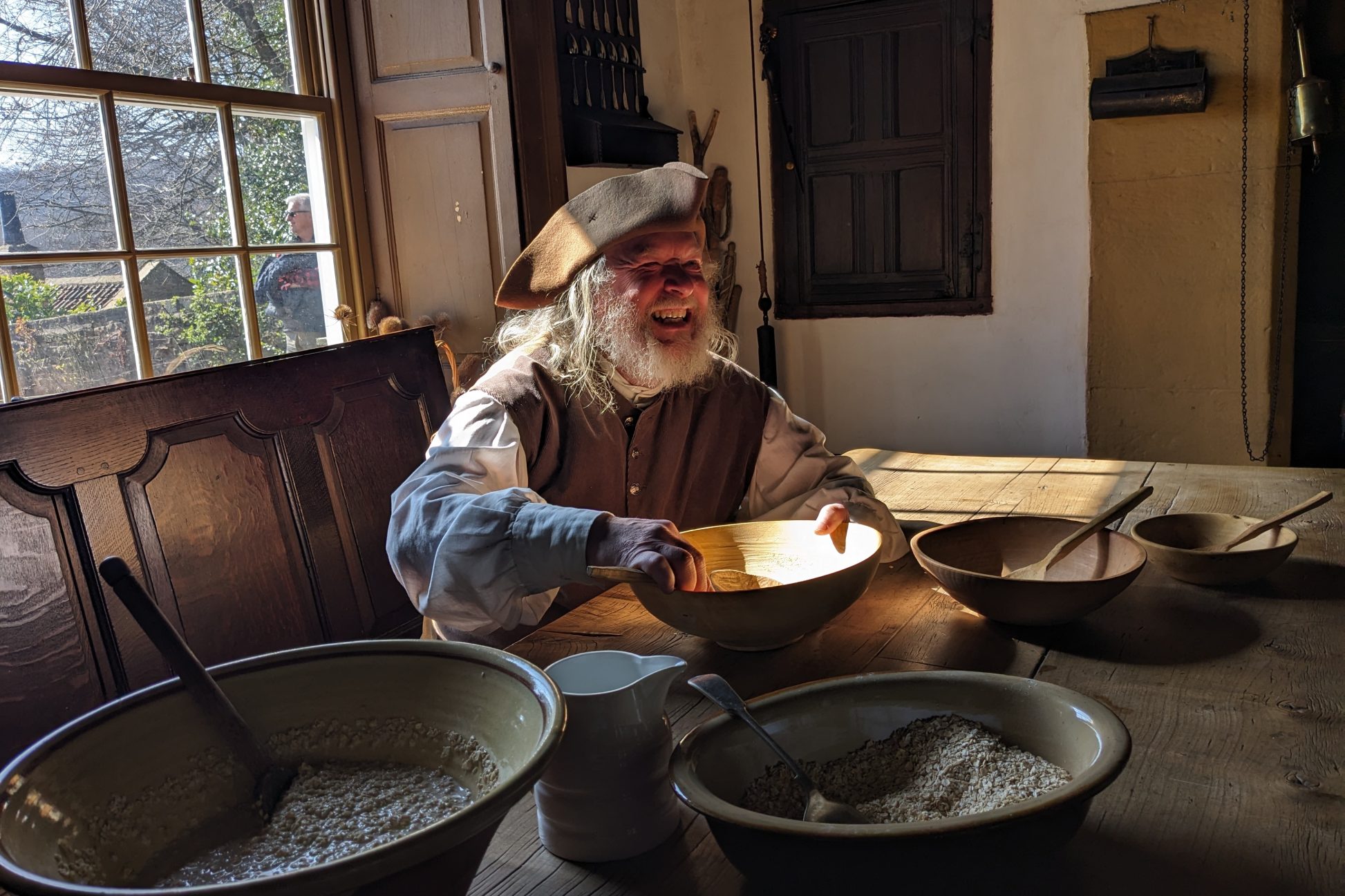 Costumed staff member smiling.