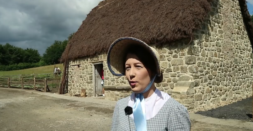 Staff member in Georgian costume.