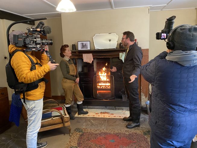 View of scene being filmed behind camera.