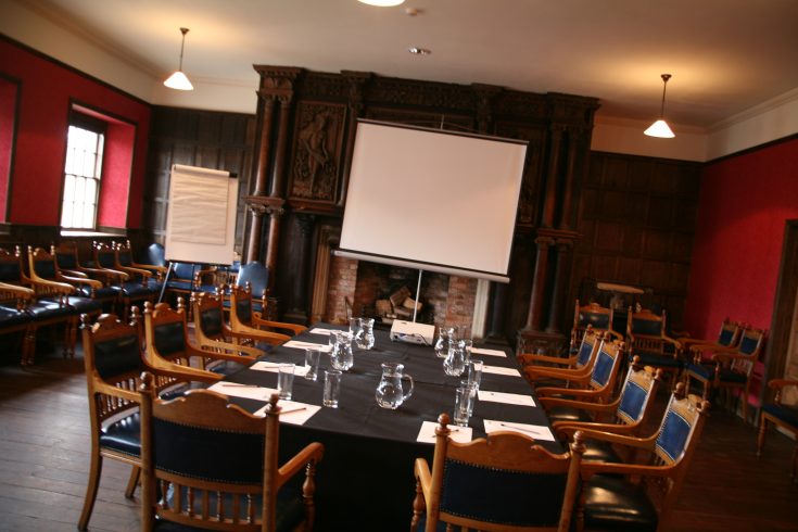 Tables and chairs laid our for conference.