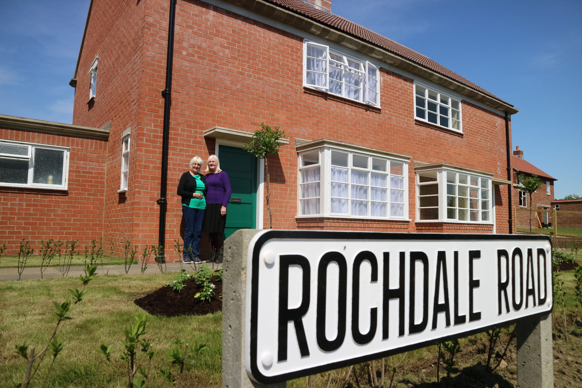 Linda and Brenda in front of Red House semi-detached houses in 1950s Town