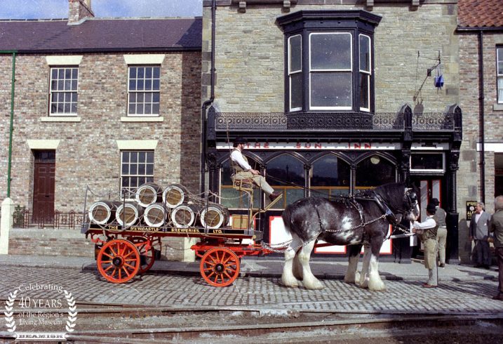 Horse and cart with barrels outside of The Sun Inn.