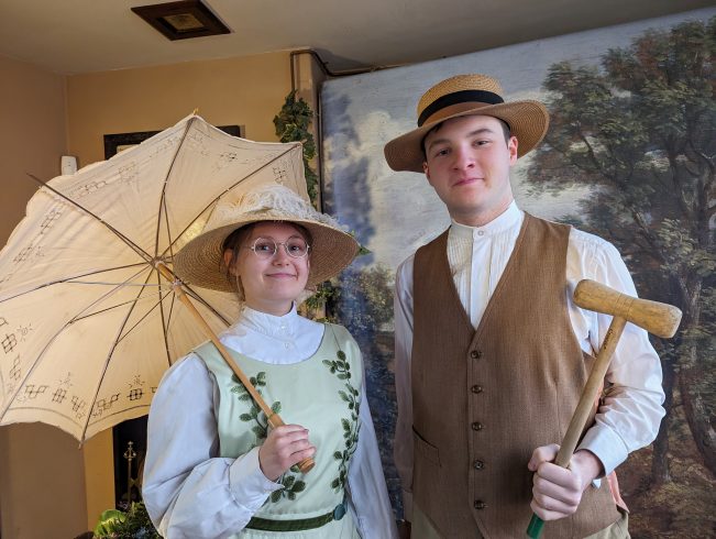 Two costumed figures.