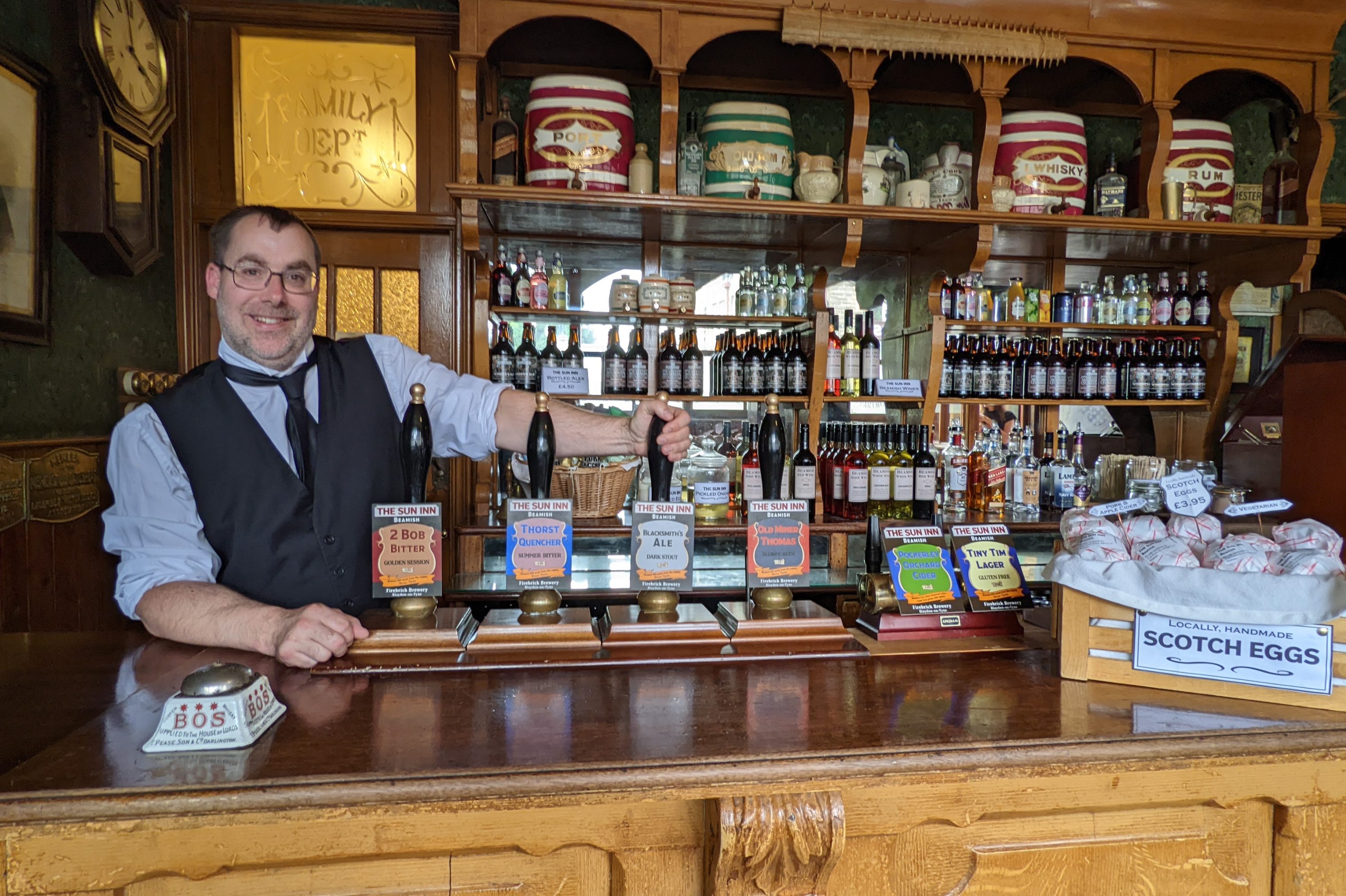 Bartender in the Sun Inn pub