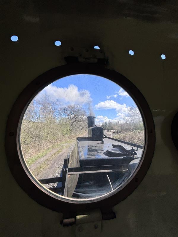View of locomotive and track from footplate window
