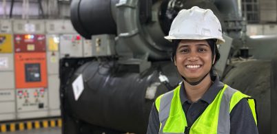 Shivani Jain Electrical Engineer photographed onsite wearing a hard hat and high visibility vest.