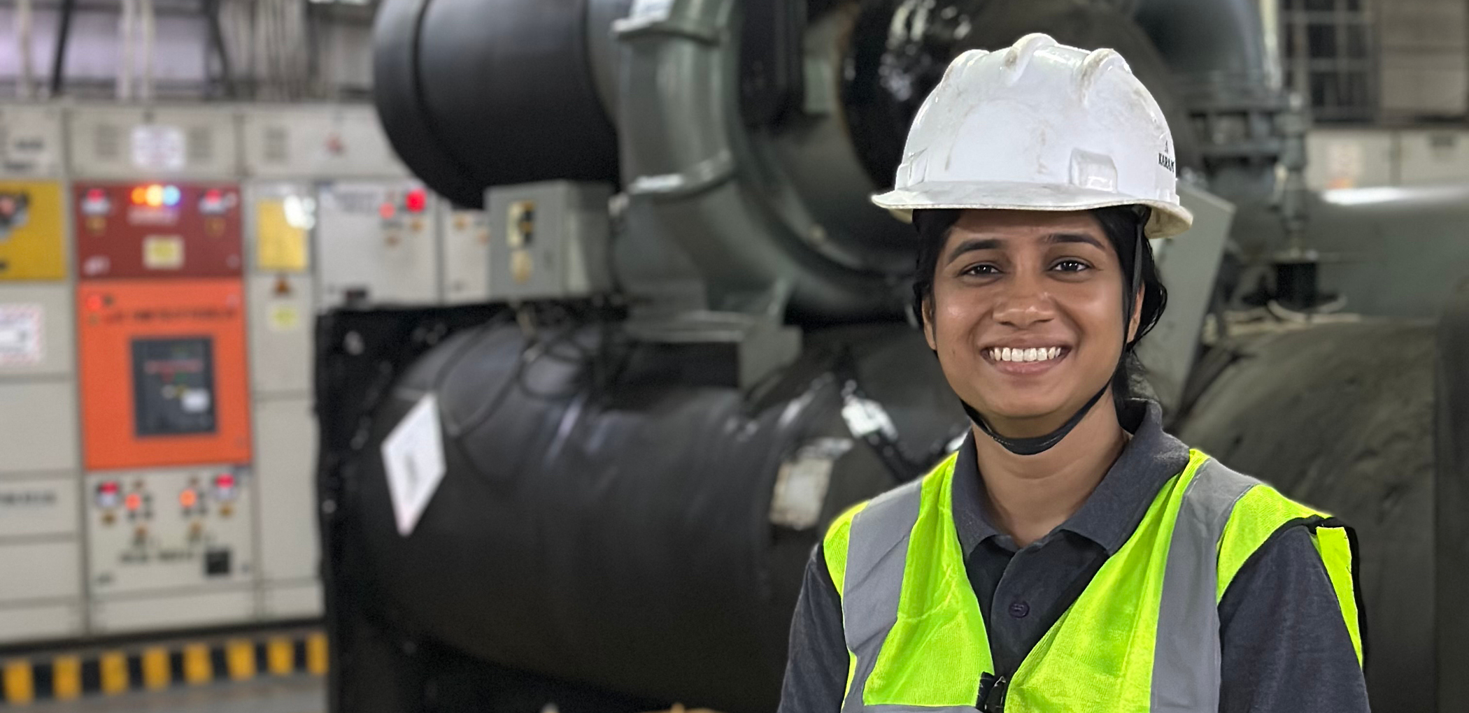 Shivani Jain Electrical Engineer photographed onsite wearing a hard hat and high visibility vest.