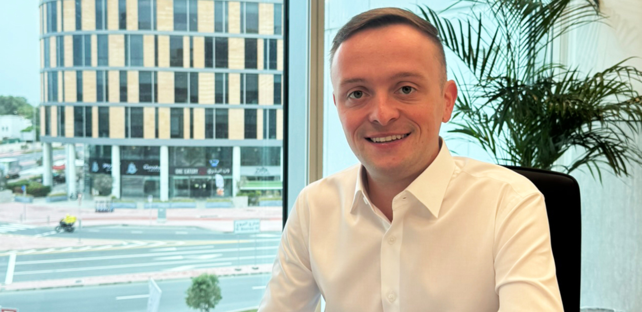 Robbie Smith Mechanical Engineer featured at his desk in our Dubai Office at Black & White Engineering.