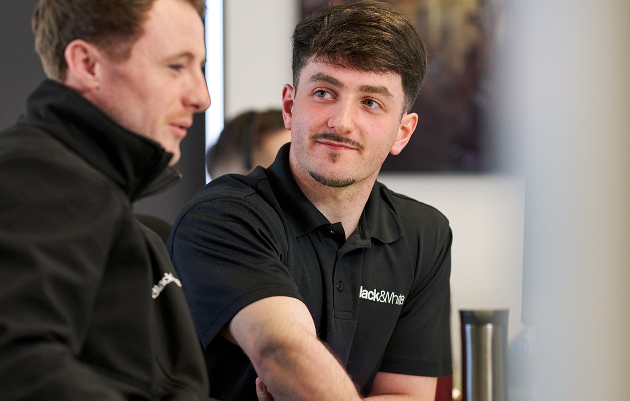 Elliot who started an Engineering Apprenticeship in Building Services being mentored by another engineer.