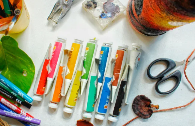 Photo of colours pens, scissors and other crafting items