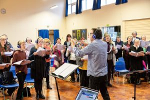 People rehearsing for a community opera