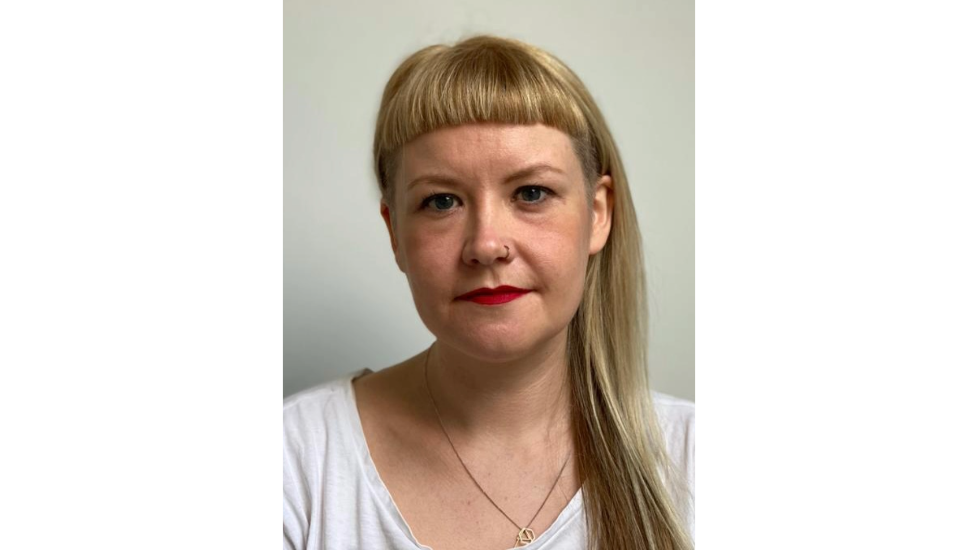 A photo of Melanie Iredale, a white woman with blonde hair and a short fringe.