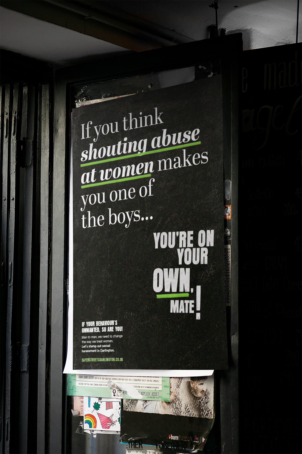 A black poster with white and green writing