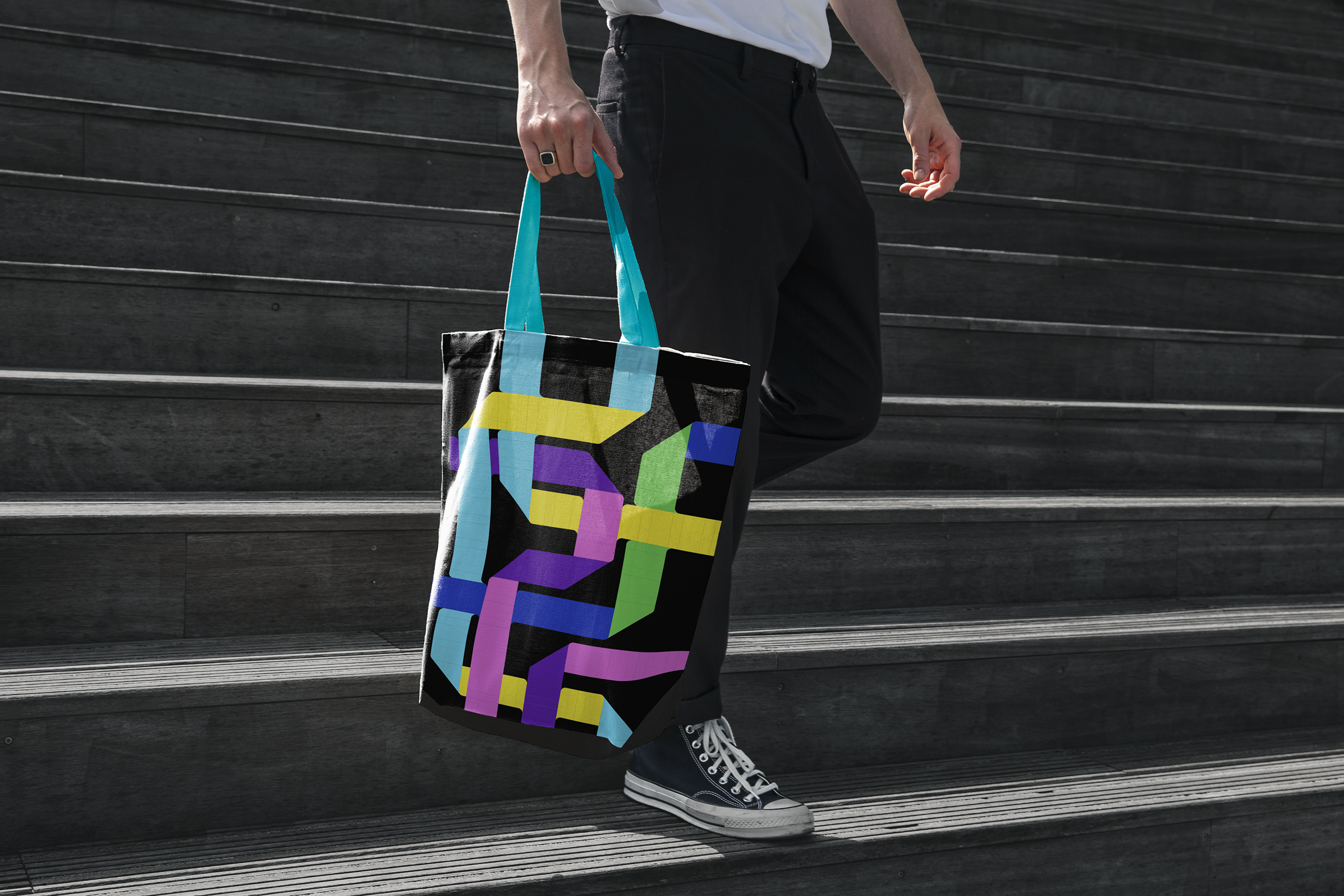 Resident of Bishop Auckland carrying a branded tote bag.