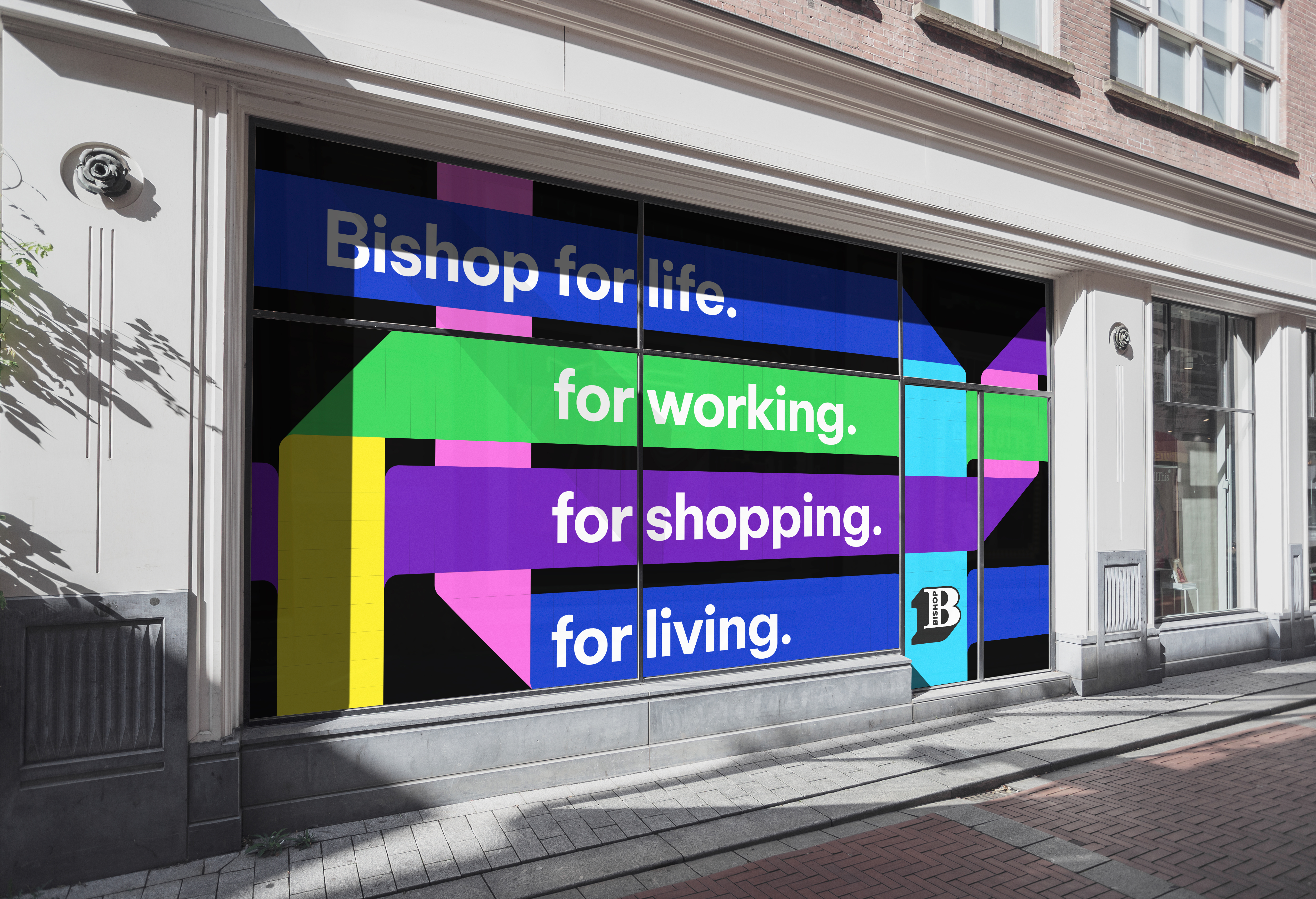 High street shop window showing Bishop Auckland regeneration branding