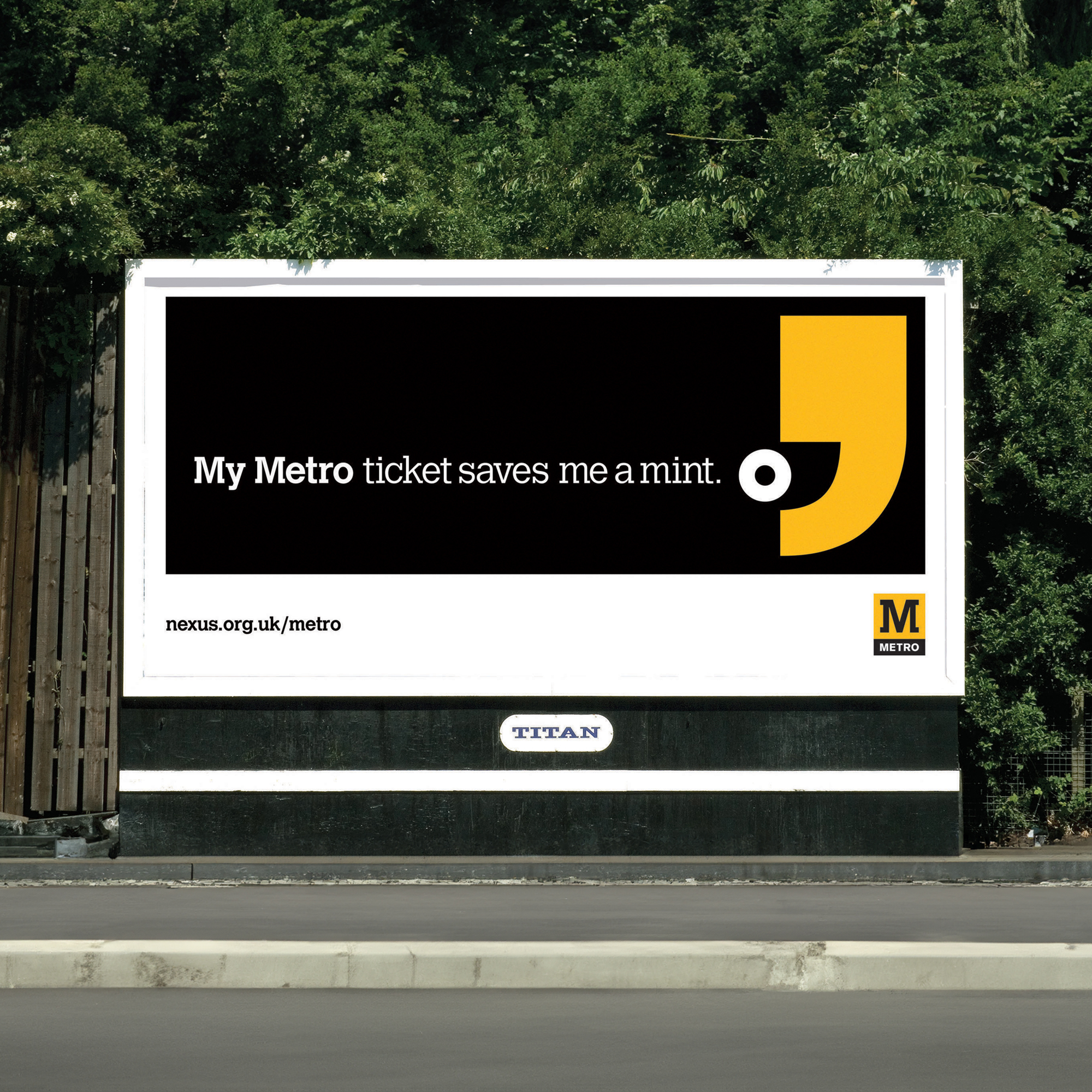An advertising board with a Metro advert that is black, white and yellow