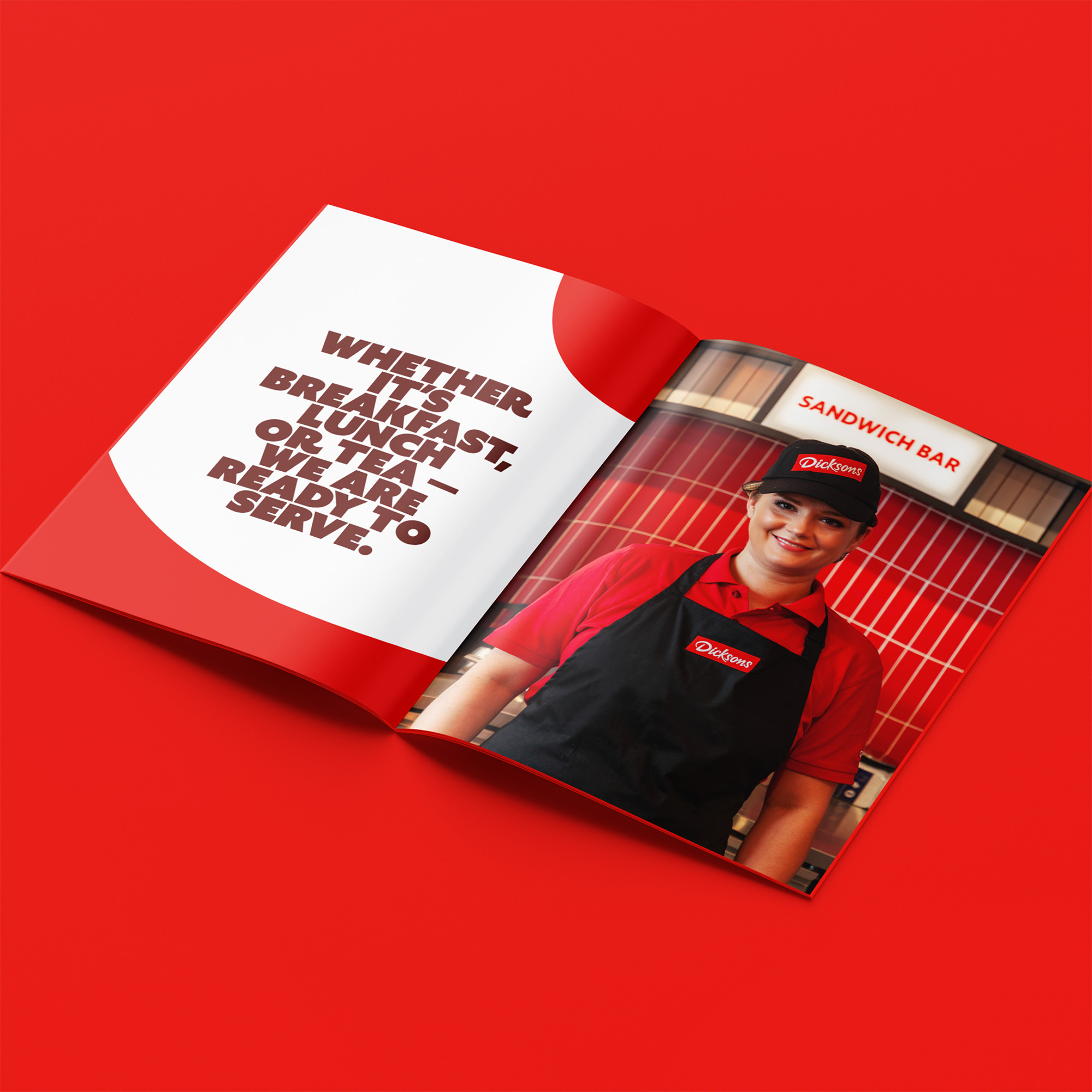 Person smiling in magazine against red backdrop.