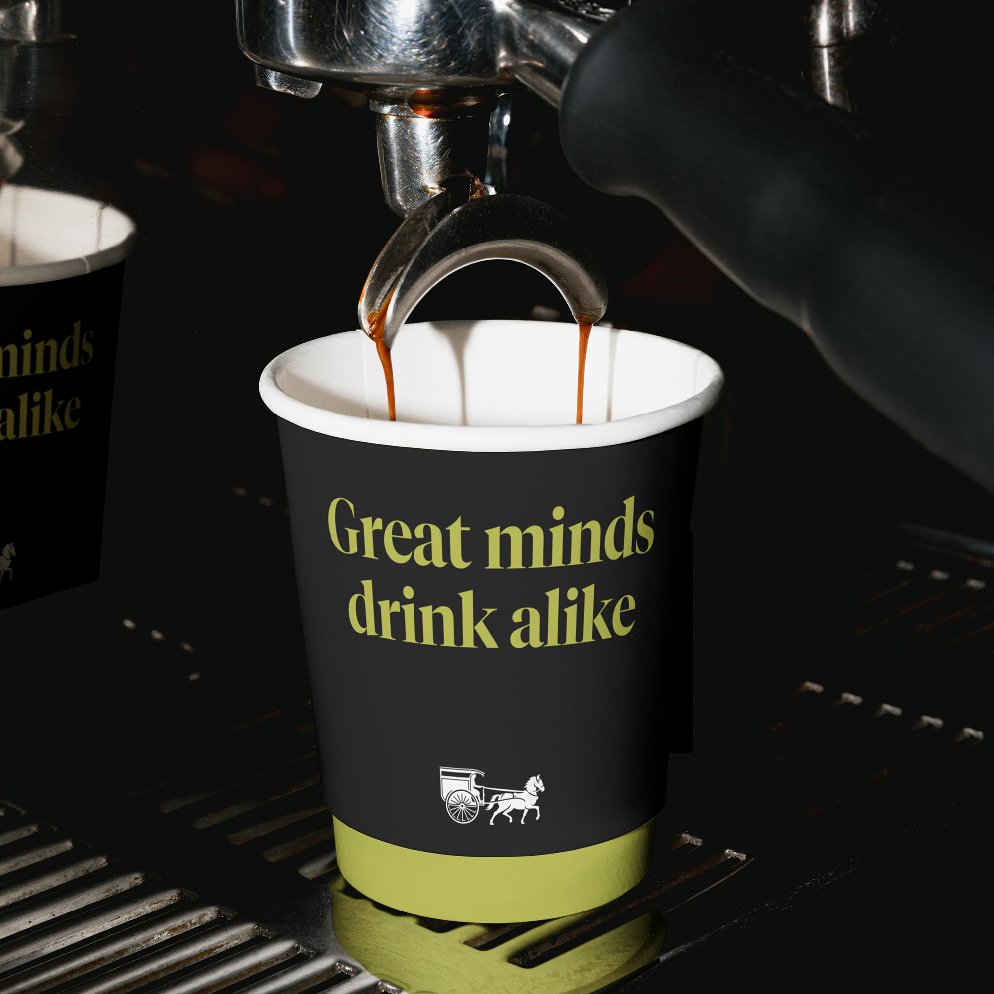 Coffee cup under espresso machine.