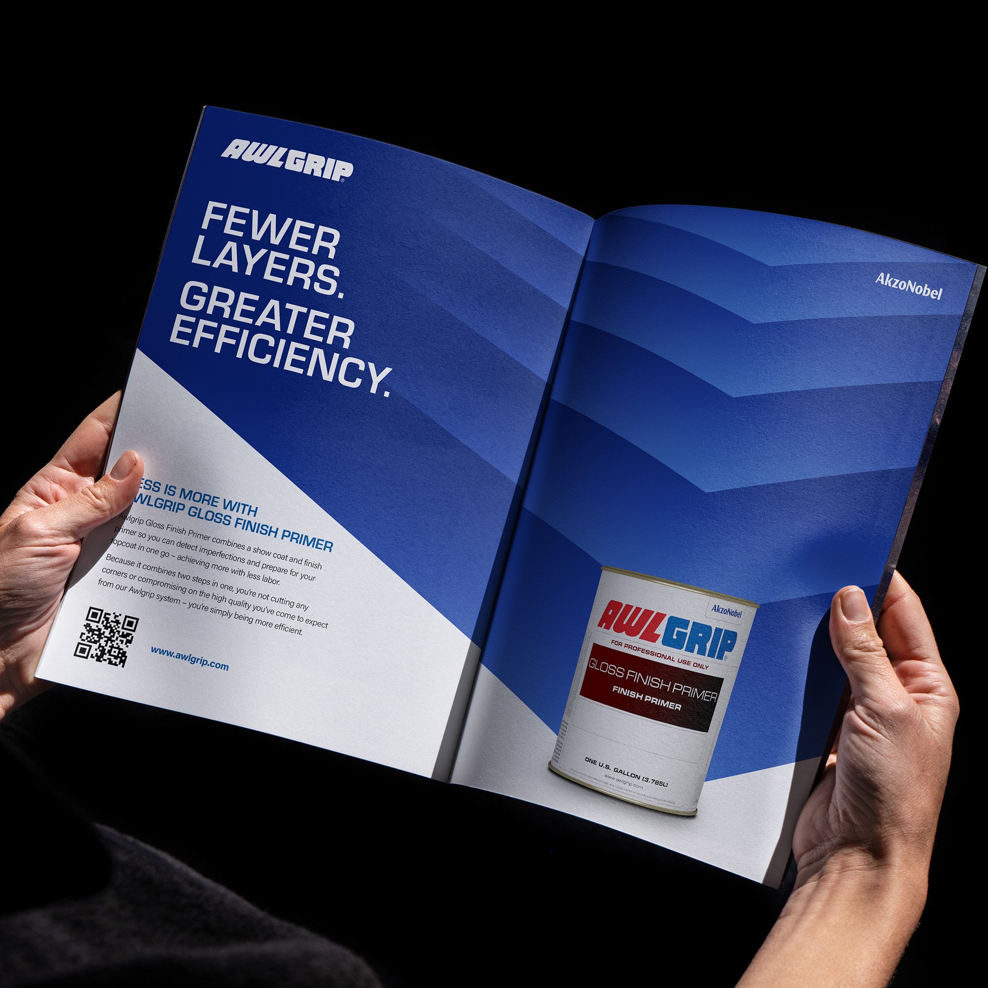 Someone reading a blue and white leaflet