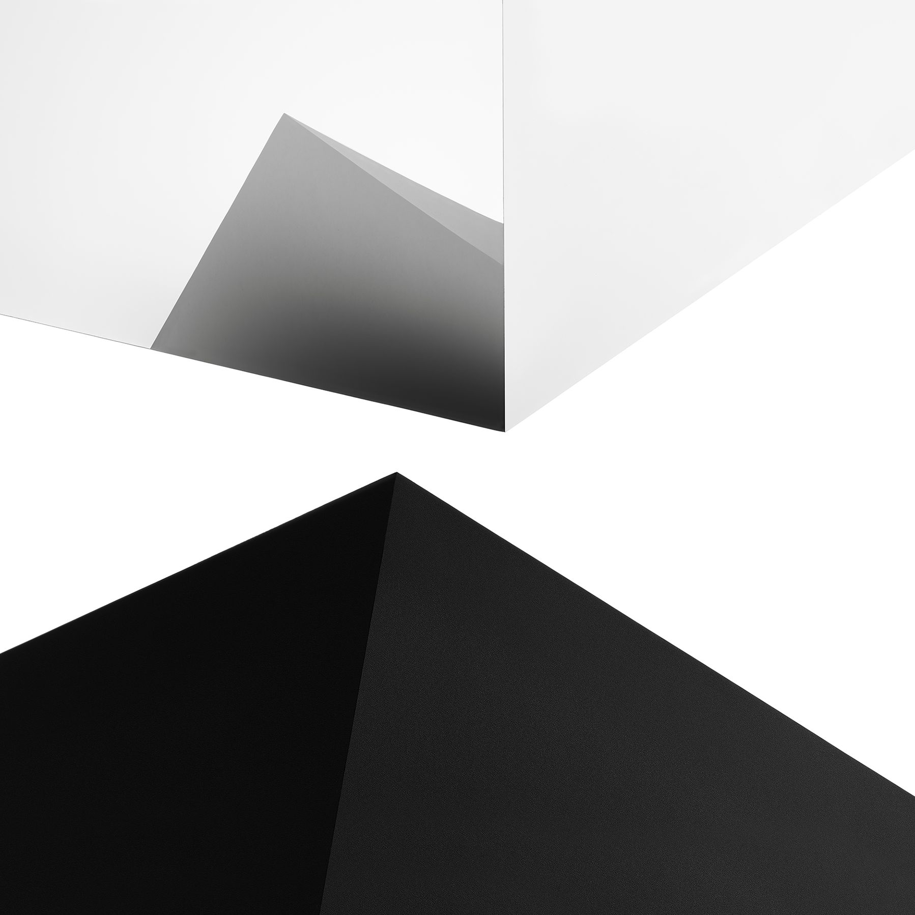 Black, white and grey shapes interjecting to create patterns.