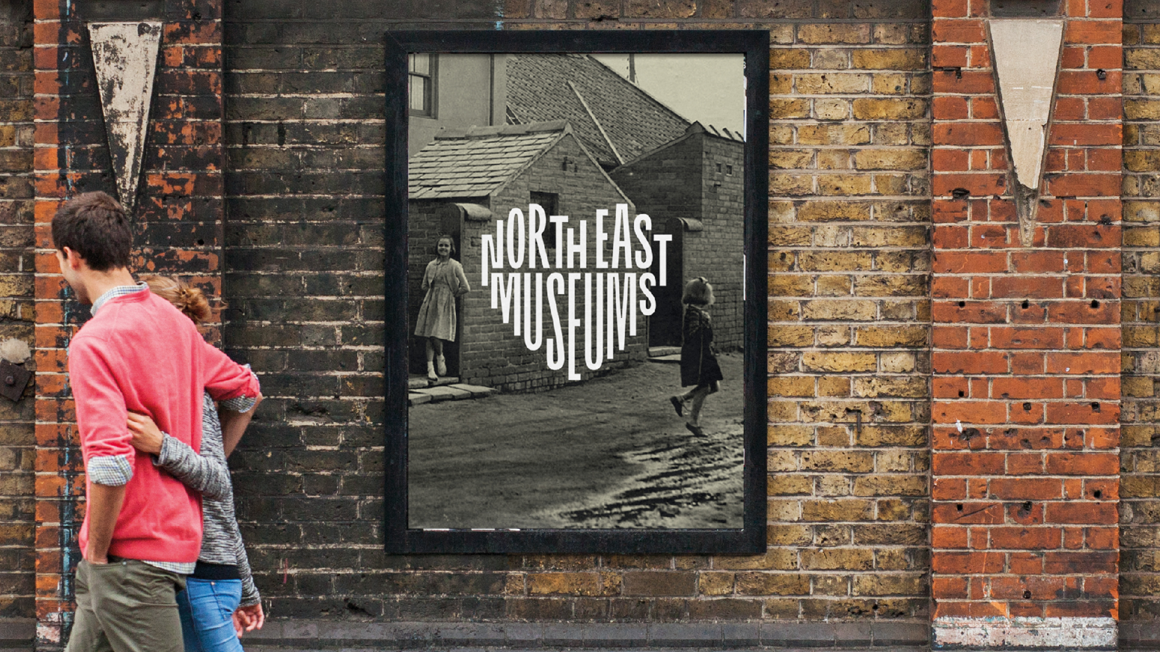 Old image set in a poster against a brick wall.