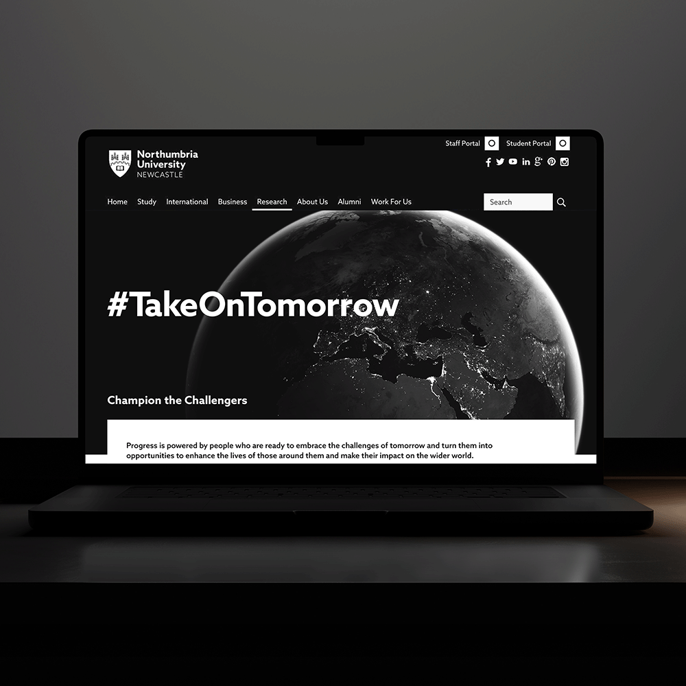 A laptop with black and white webpages.