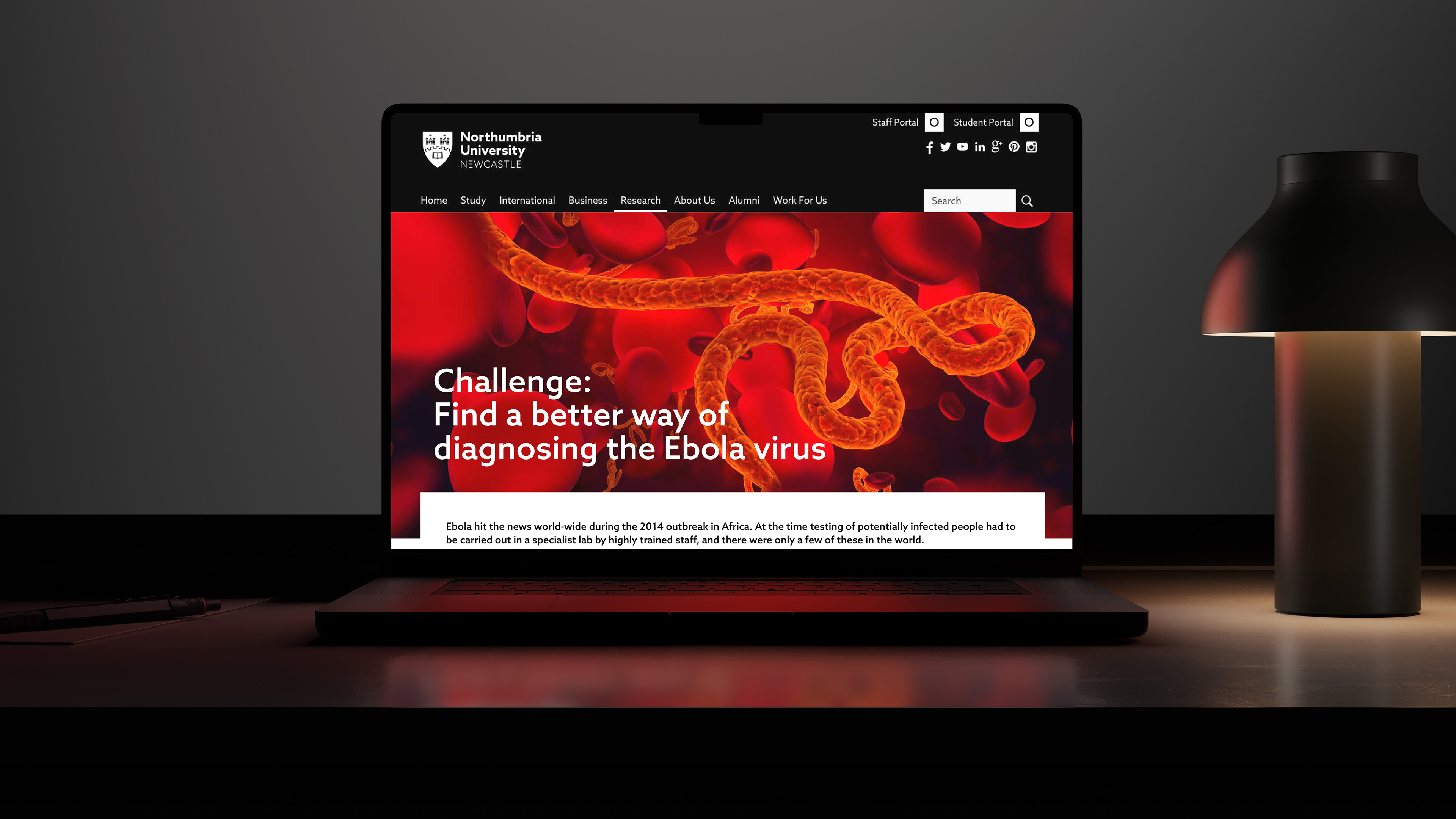 A laptop with a red and black website.