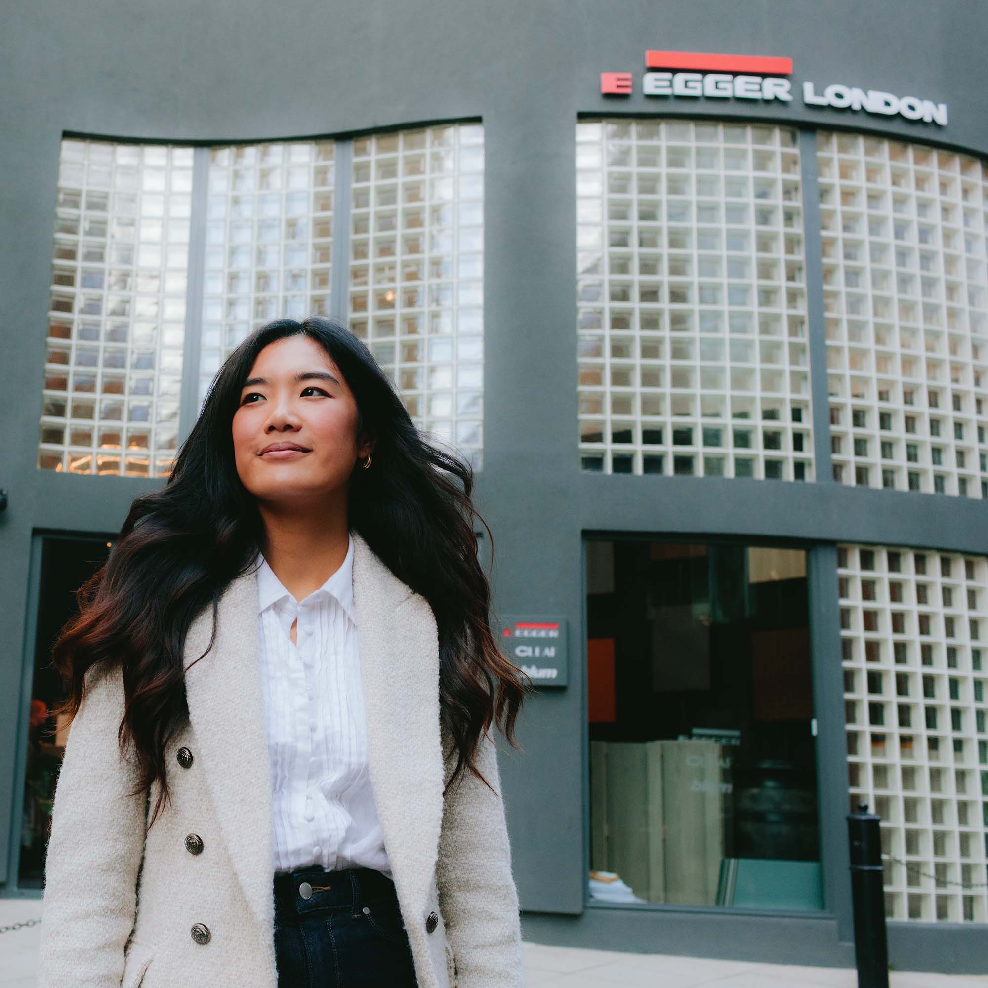 Confident female designer outside Egger London showroom