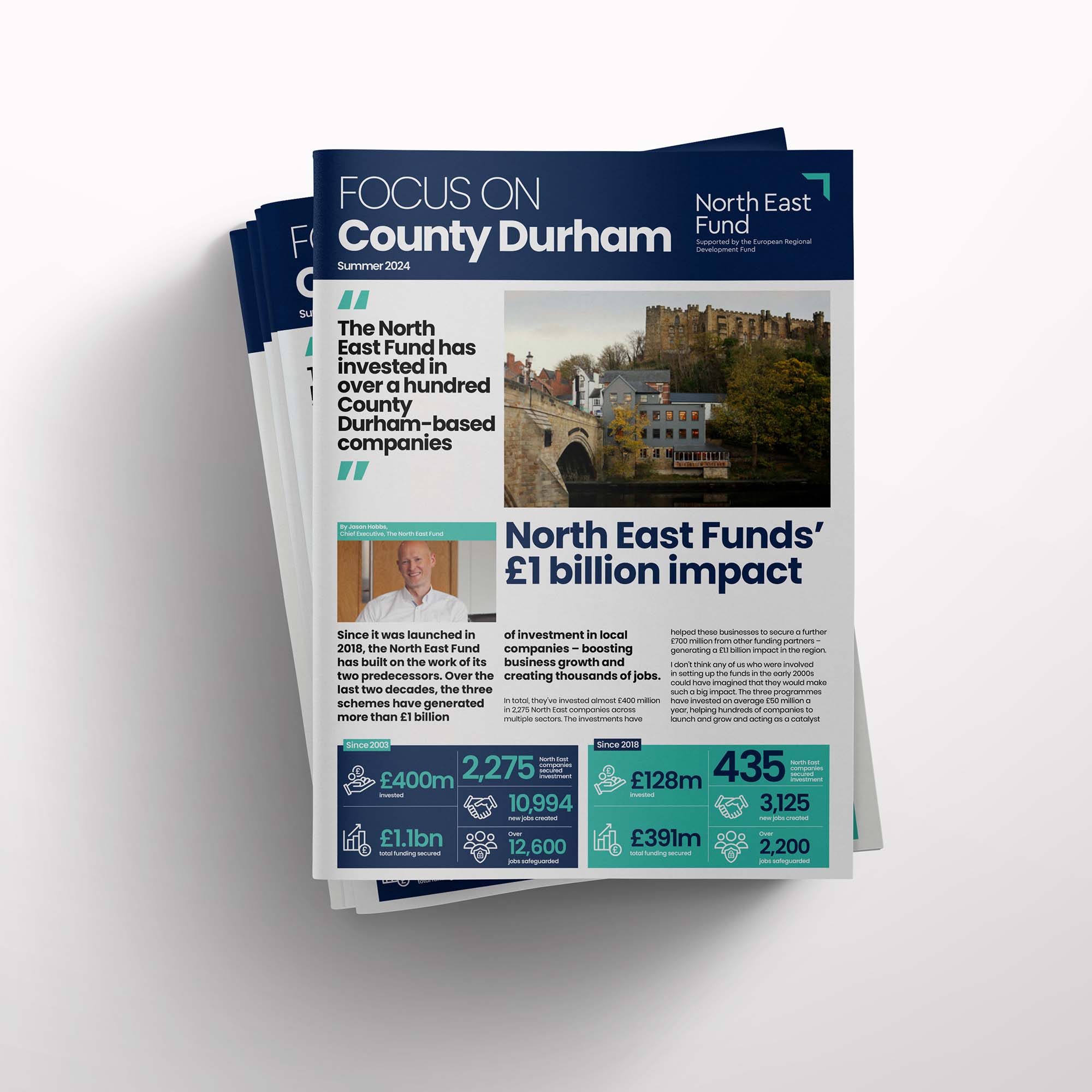 Stack of North East Fund magazines on a white background