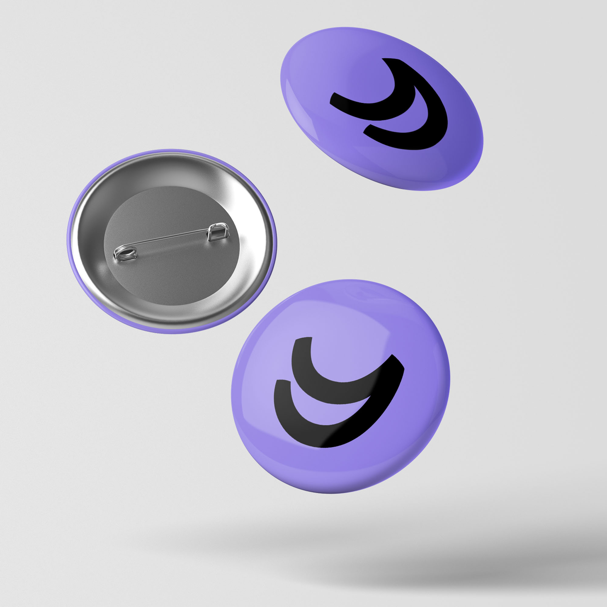 Three branded purple pin badges floating on light grey background