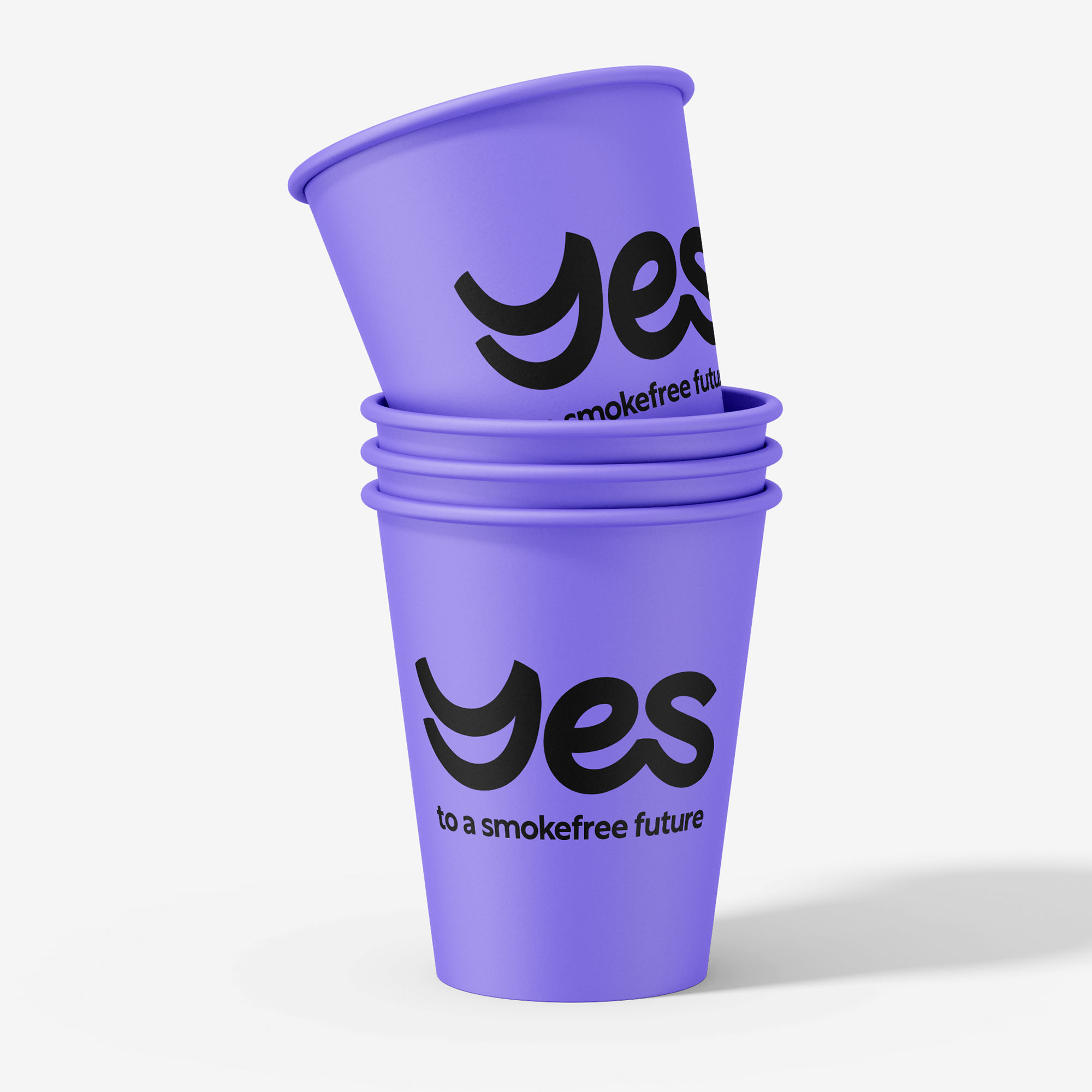 Stack of branded purple disposable cups with YES logo and strapline 'to a smokefree future'