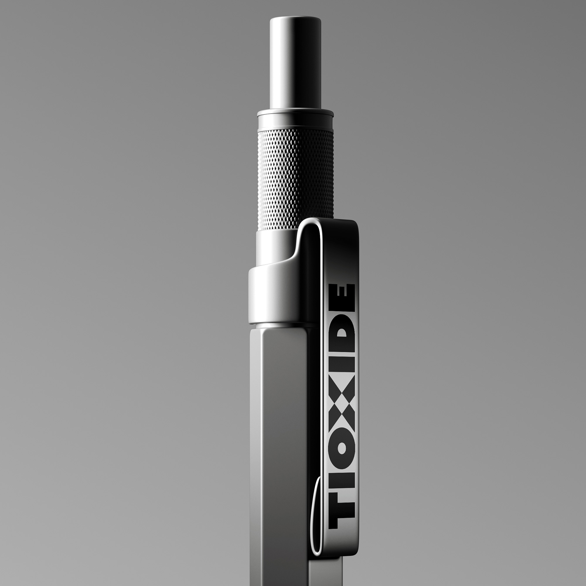 Modern silver metalic pen against a plain grey background with the new Tioxide identity on the clip device.