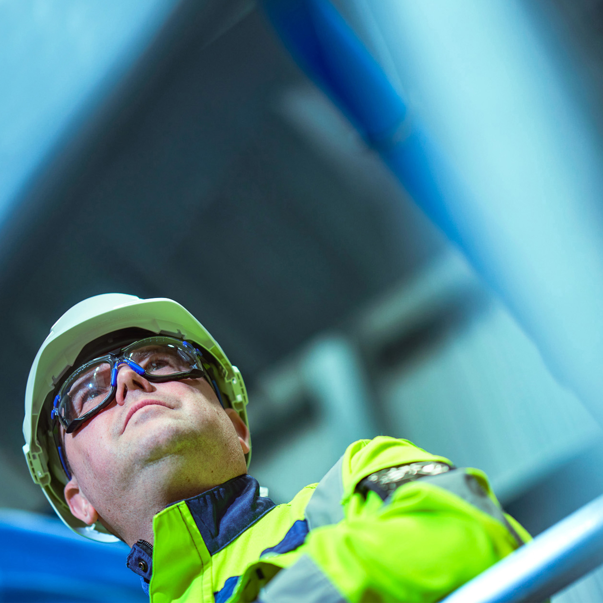New brand photograph of Tioxide team member in a factory environment wearing protective workwear.