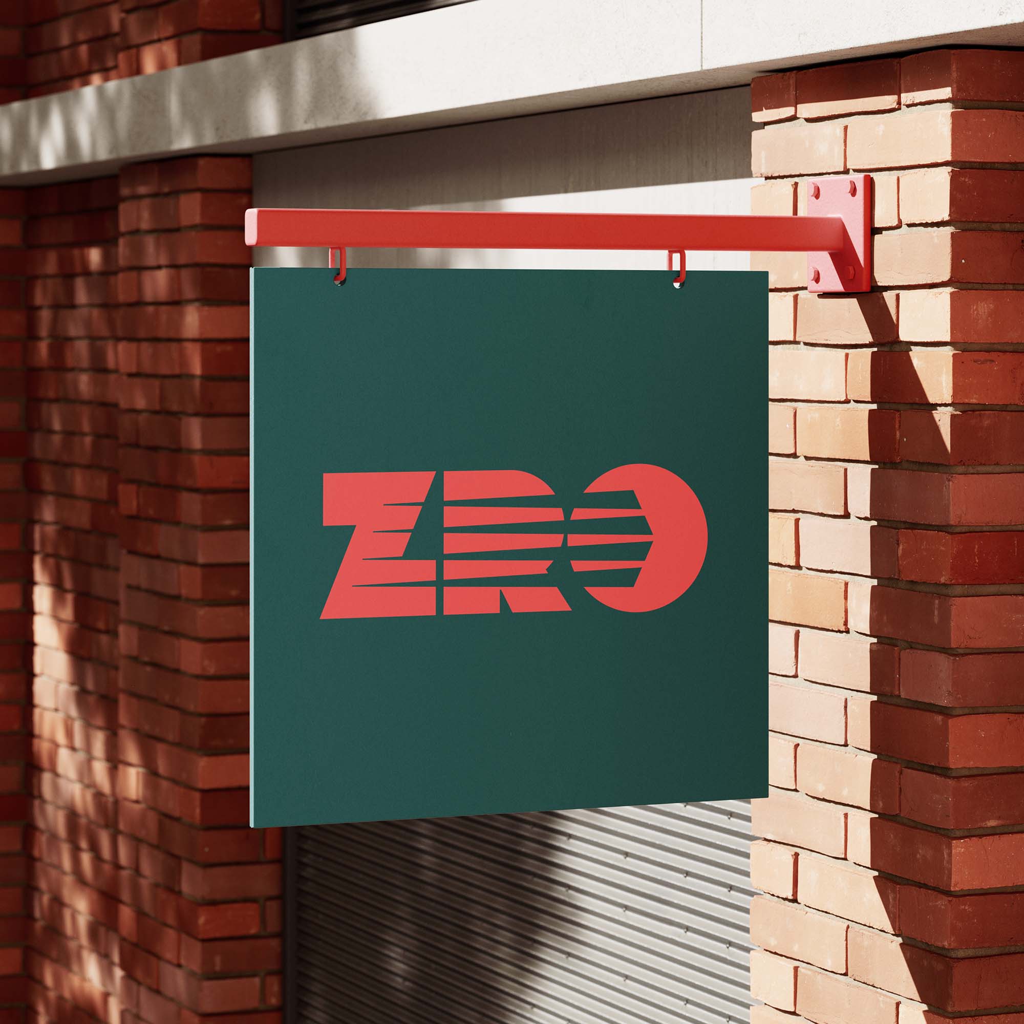 ZRO branded hanging sign on an outside wall on a sunny day.
