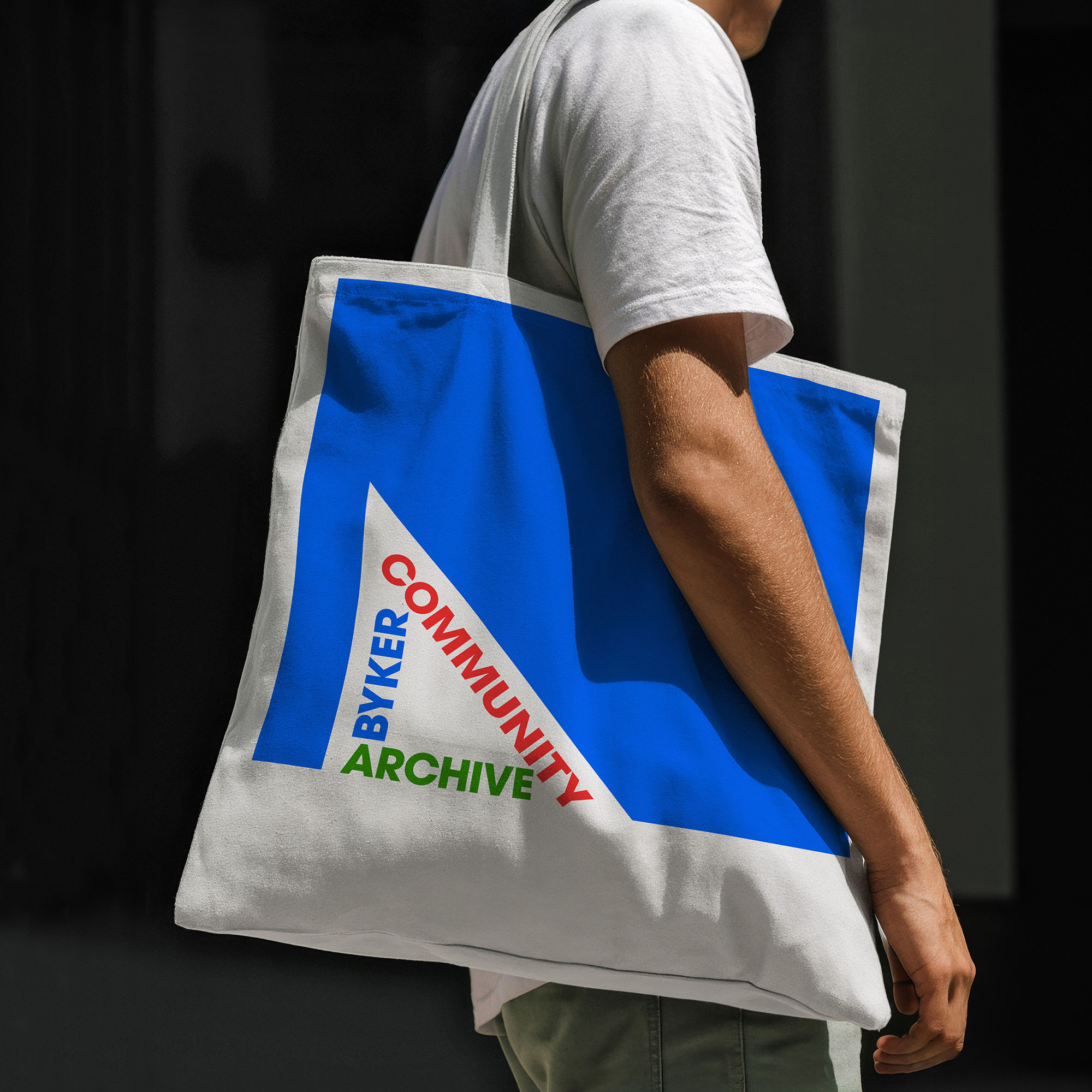 Byker Community Archive tote bag over a young man's shoulder.