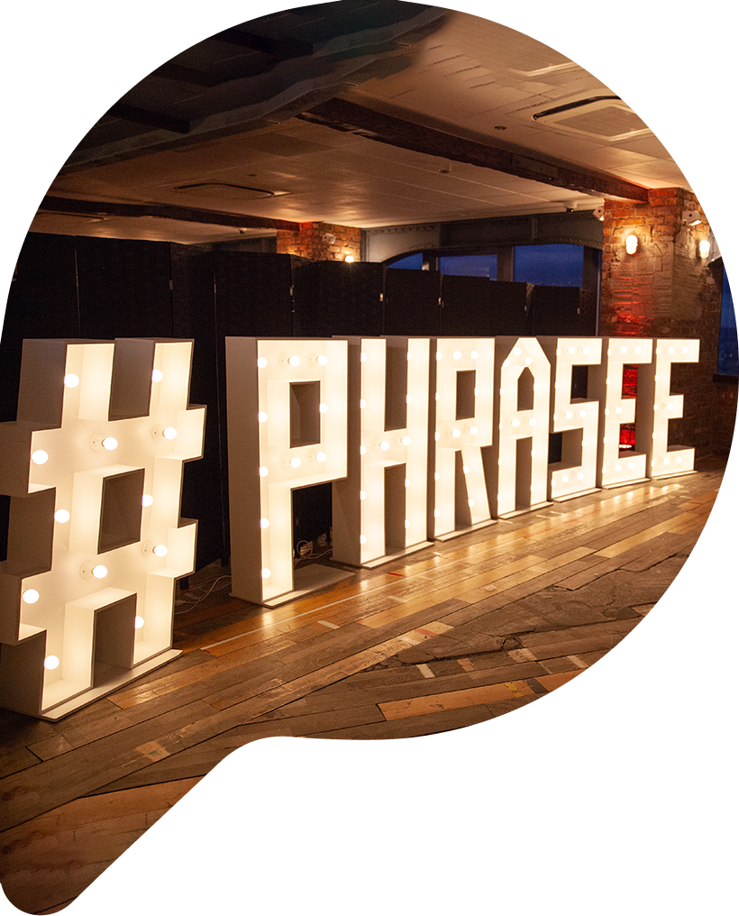 Light-up sign saying #Phrasee